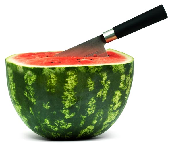Watermelon with a knife in it.