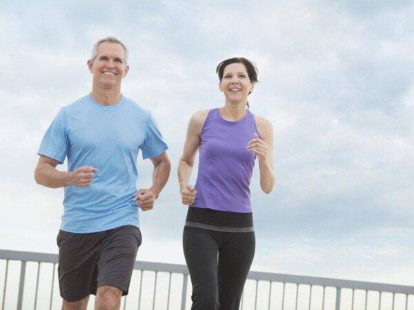 Happy mature couple still healthy enough to go jogging.